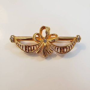 vintage Joan Rivers gold ribbon brooch